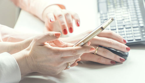 Close-up of woman using mobile phone