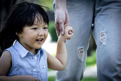 Cute boy smiling while sitting on floor