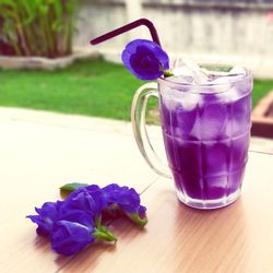 Close-up of blue drink on table