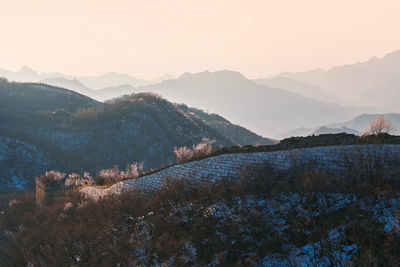 Scenic view of mountains against sky during sunset