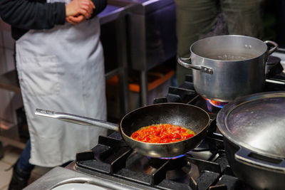 Midsection of man preparing food