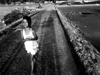 Girl walking on road