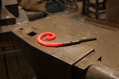 Close up view of heated metal and anvil. the blacksmith in the production process of metal products