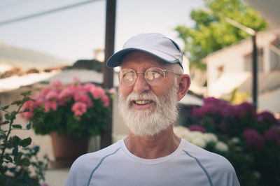 Smiling man looking away in garden