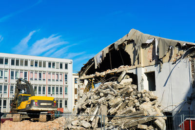 Low angle view of building against blue sky