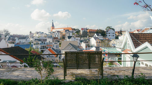 Buildings in town against sky