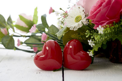 Close-up of red roses on table