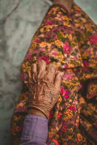 High angle view of senior woman sitting at home