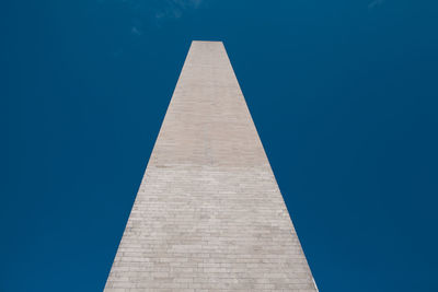 Low angle view of monument against clear blue sky