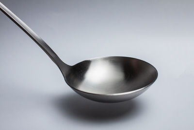 Close-up of wineglass against white background