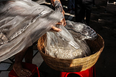 High angle view of woman in wicker basket