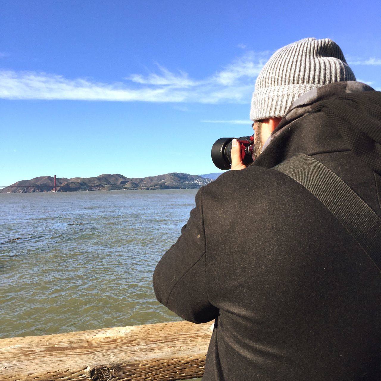 lifestyles, sky, sea, leisure activity, water, rear view, men, standing, blue, cloud - sky, looking at view, casual clothing, cloud, vacations, scenics, tourist, nature, photographing