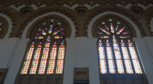 Low angle view of stained glass window of building