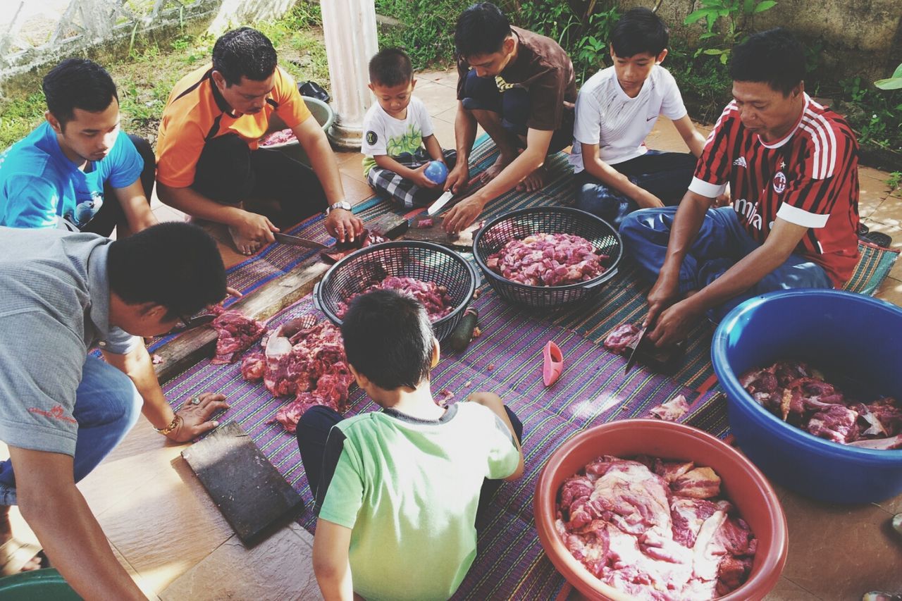 lifestyles, men, person, leisure activity, large group of people, sitting, togetherness, casual clothing, food and drink, medium group of people, high angle view, friendship, table, day, outdoors, mixed age range