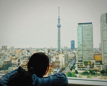 Woman looking at city skyline