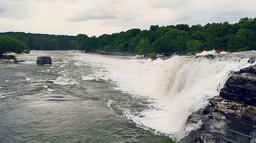 Scenic view of sea against cloudy sky