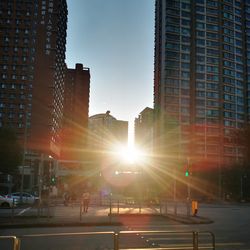 Low angle view of skyscrapers against sky at dusk