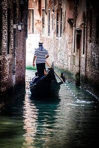 Man in boat on canal