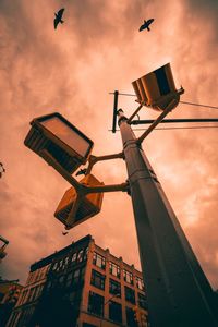 Low angle view of street light against sky