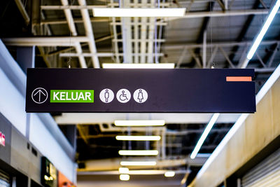 Low angle view of text on railroad station