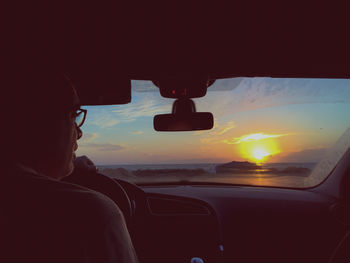 Sunset seen through train windshield