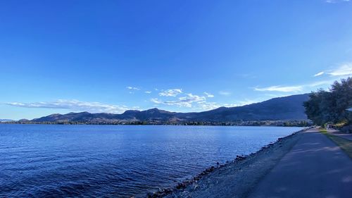 Scenic view of lake against blue sky