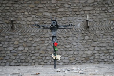 Cross shape on stone wall