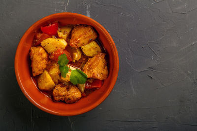 Food for suhoor in ramadan lamb stew with potatoes on a gray background. horizontal photo