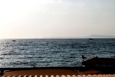 Scenic view of sea against clear sky during sunset