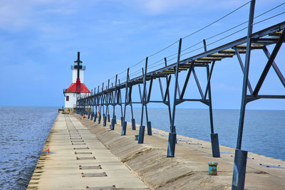 Pier over sea against sky
