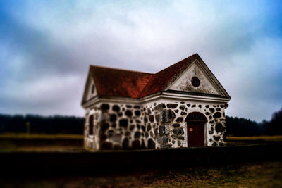 Built structure against cloudy sky