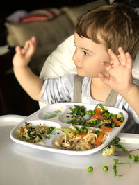 High angle view of man having food in plate