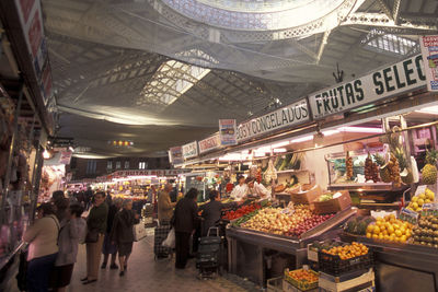 People at market stall in city