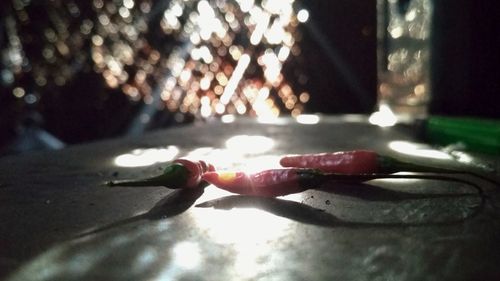 Close-up of burning candle on table