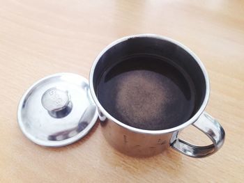 High angle view of coffee cup on table