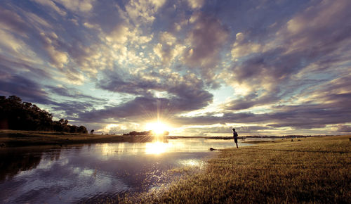 Scenic view of sunset over lake