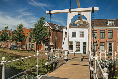 Building by street against sky