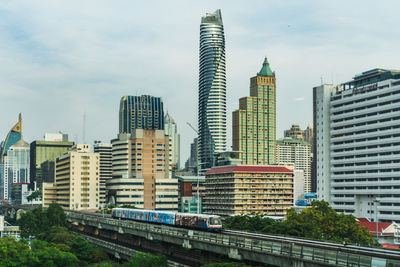 Buildings in city against sky