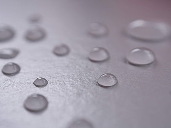 High angle view of raindrops on glass