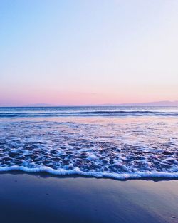 Scenic view of sea against clear sky during sunset
