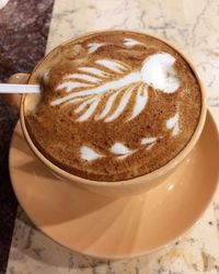 Close-up of cappuccino on table