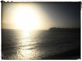 Scenic view of sea against clear sky during sunset