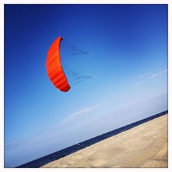 Scenic view of sea against blue sky