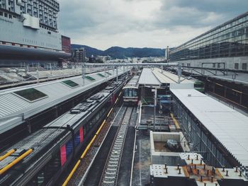 High angle view of train on railroad tracks in city