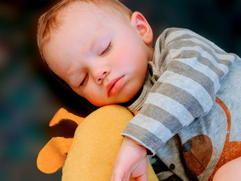 Cute little baby sleeping with toy at home. bedtime