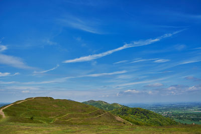 Scenic view of landscape against blue sky