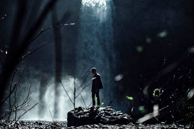 Man with umbrella at night