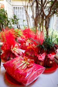 Close-up of red flowers on table