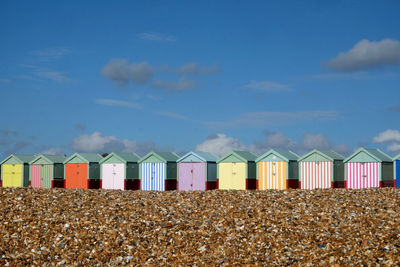 Beach huts against blue sky