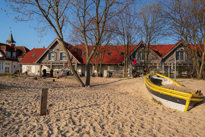 House on beach against sky